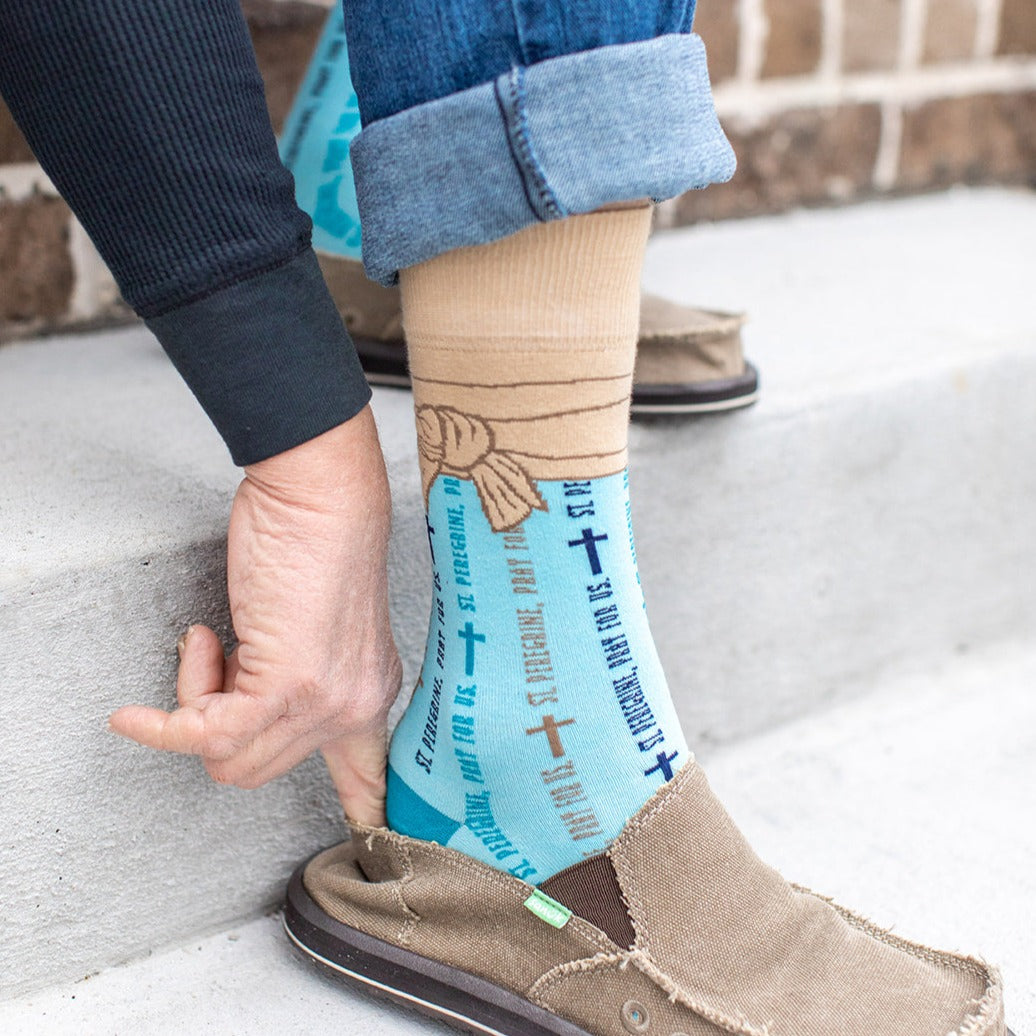 a person wearing a pair of shoes and a blue socks with words on them