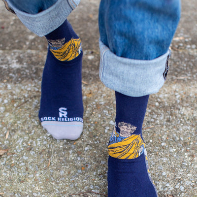 a close up of a person wearing blue socks