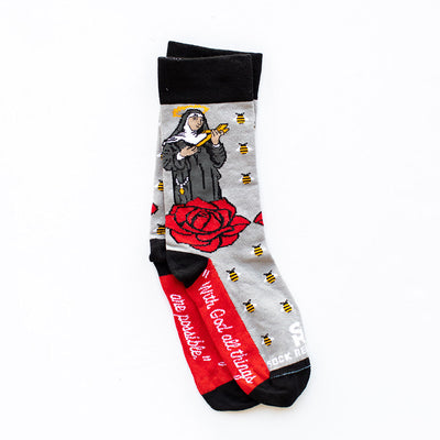 a pair of socks with a picture of St. Rita