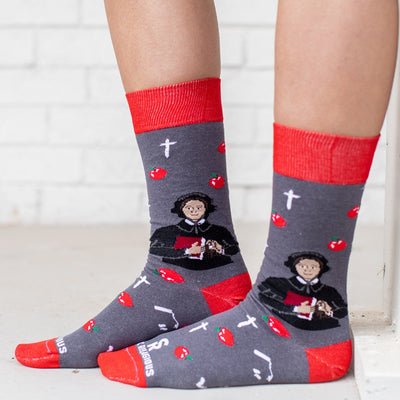 a person wearing a pair of socks with a picture of St. Elizabeth Ann Seton