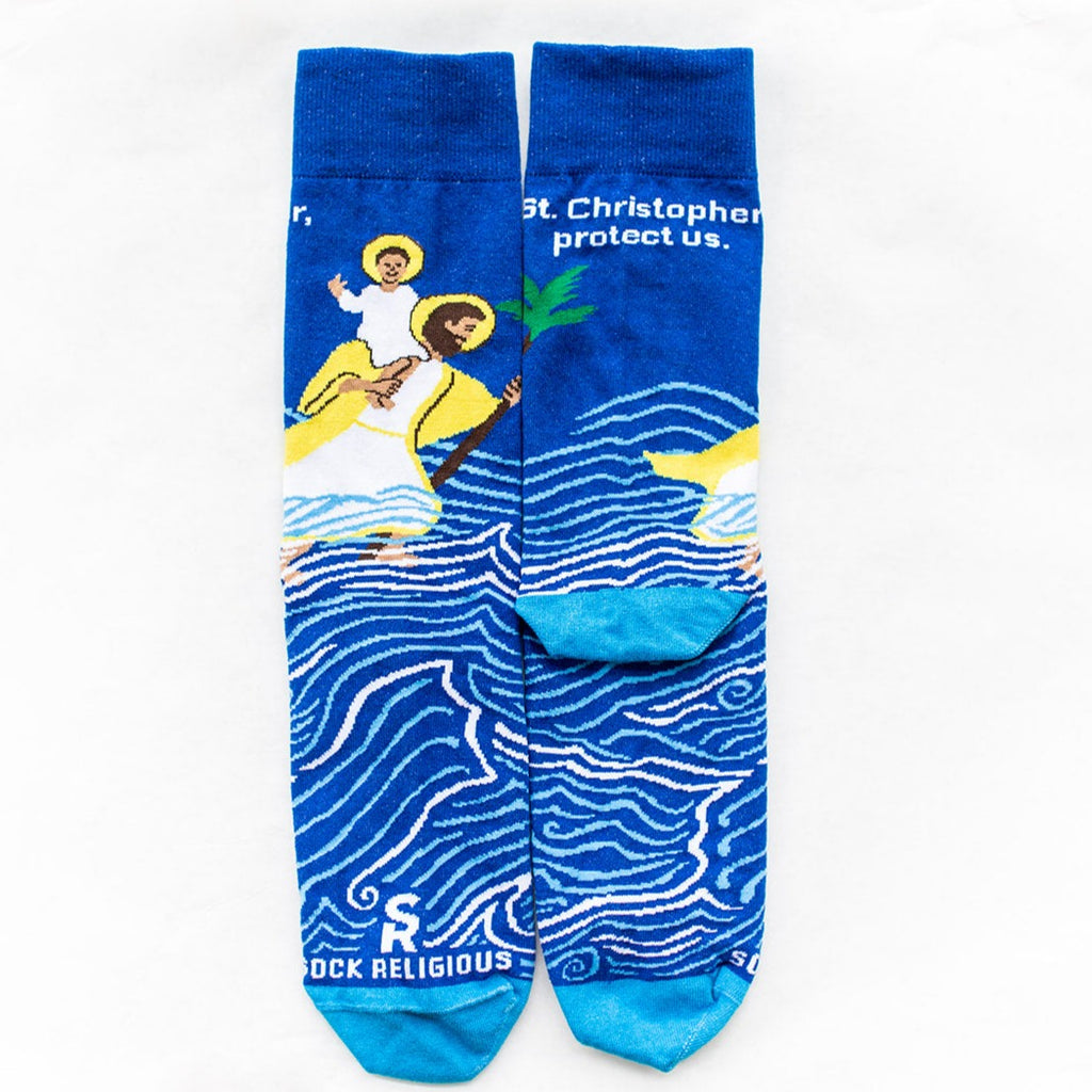 a pair of blue socks with a picture of St. Christopher