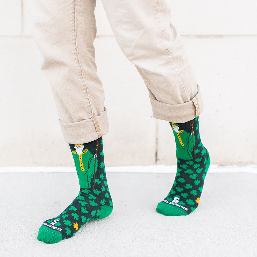man walking wearing Green socks with green clovers and St. Patrick of Ireland