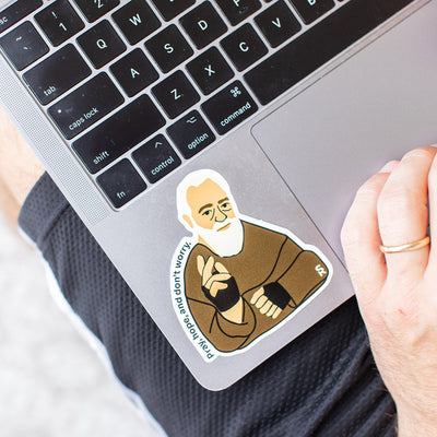 St. Padre Pio sticker that says "Pray, Hope, and Don't Worry" on a laptop
