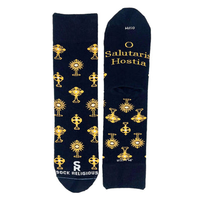 A stylish pair of black socks featuring shiny golden monstrances and text