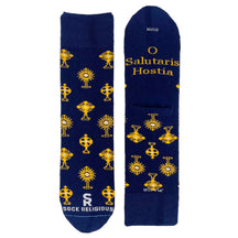 A stylish pair of blue socks featuring shiny golden monstrances and text