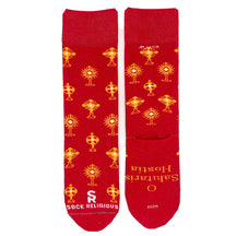 A stylish pair of red socks featuring shiny golden monstrances and text